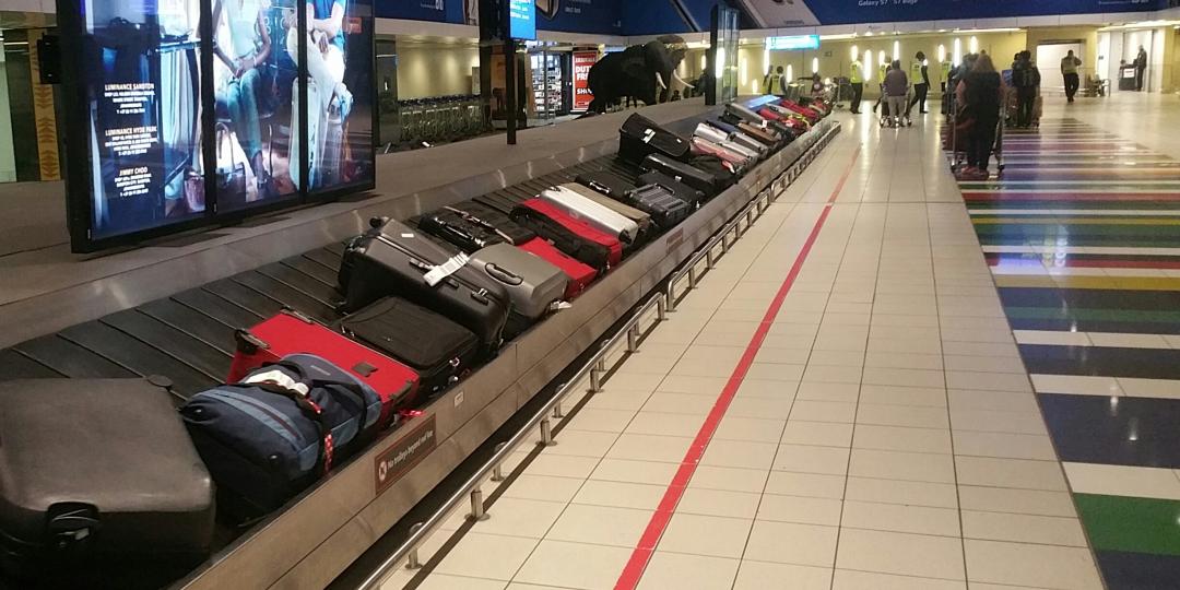 What is wrong with this picture? Every bag here represents an irate traveller to South Africa. South Africans have cleared immigration collected their bags and left the airport. Foreign passport holders will take up to two hours to get here, airlines report.