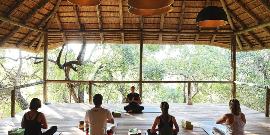 Facing the demands of modern-day society, more and more travellers are opting for wellness experiences when visiting southern and East Africa. Image: Safari yoga at Londolozi.