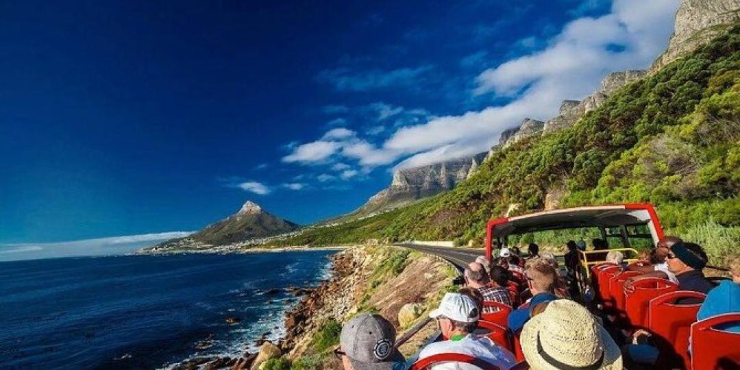 Tourists on an open-top sightseeing bus in Cape Town.