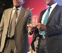Former Ethiopian Airlines CEO and former RwandAir chairman, Girma Wake, presents IATA VP for Africa, Raphael Kuuchi, with a life-time achievement award at the AviaDev conference in Cape Town.